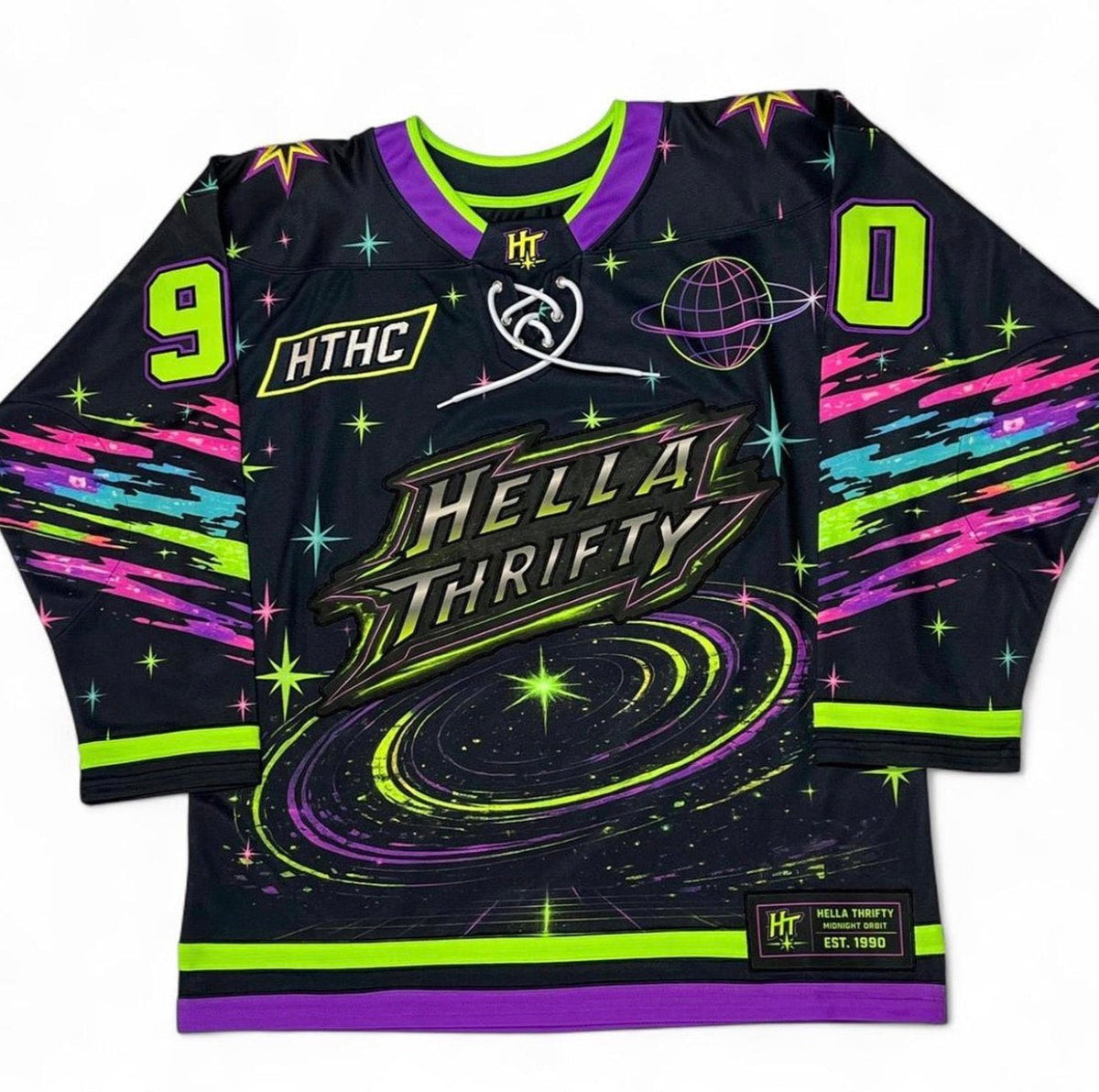 A black hockey-style jersey with neon green, purple, and pink graphics. The front shows the text 'HELLA THRIFTY' over a swirling galaxy design, with large green numbers 9 and 0 on the shoulders, 'HTHC' on the chest and sleeve, and a small 'Hella Thrift Co EST.